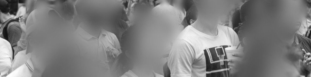 A crowd of people with every face blurred